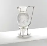 for Hukin & Heath by Christopher Dresser, 1879, Electroplated metal and cut glass, the spout and collar joined to the base with a curved handle, raised on three crow's , sold Mar 2025