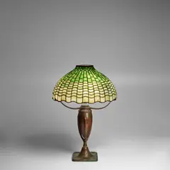 Geometric Table Lamp by Tiffany Studios, leaded glass, patinated bronze, the base stamped 'TIFFANY STUDIOS 444', 'S221' and monogrammed, sold Dec 2025