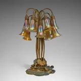 Tiffany Studios, Twelve-Light 'Lily' Table Lamp, Favrile glass, bronze with etched doré finish, base stamped 'TIFFANY STUDIOS NEW YORK 382', each favrile shade etched 'L