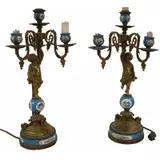 Sèvres, Bronze Mounted Urns Together With A Pair, The urns blue with gilt bronze mounts and the lamps with bronze Cherubs