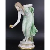 Polrcelain Figure Of A Lady playing Ball by Meissen, sold May 2022
