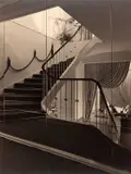 Lucca Chmel, Staircase in an elegant store, seen through a mirror wall, Vienna 1946, 1946, Gelatin silver print, printed in the 1950s on double-weight matte paper, flush-mounted on original cardboard