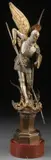 Léon Pilet, The Archangel Michael Defeating Satan, Bronze with silver, gilt and brown patina mounted on a circular rouge marble base
