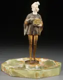 Hans Keck, A Medieval Prince Holding a Jeweled Casket -, Cold painted gilt bronze and ivory on carved onyx octagonal hallowed base