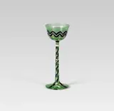 Liquor glass by Friederike (Fritzi) Löw, green glass, black and white enamel; bottom with engraving and monogram: "FL.", "WW.", sold Dec 2019