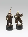 2 Clowns by Bruno Zach, bronze, cast, cold painted; ivory; the clown with pen signed on the base: "Zach";  black marble base, offered Jun 2018