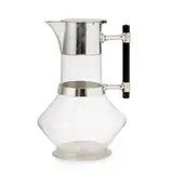 ELECTROPLATE-MOUNTED DECANTER JUG, CIRCA 1880 by Christopher Dresser, 1880, the clear glass body with cylindrical neck to lozenge shaped flared body and star cut base, sold Apr 2020