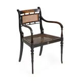SCARCE EBONISED ARMCHAIR, CIRCA 1890 by George Walton, 1890, the curved back with caned panel above later upholstered drop in seat, sold Apr 2020
