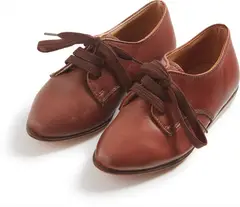 Two Shoes by Sherrie Levine, 1992, Children’s leather shoes with cloth shoe laces, sold Oct 2017