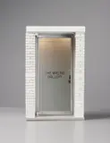 Maurizio Cattelan, The 1:6 Scale Wrong Gallery, 2006, Wood, brass, steel, aluminum, resin, plastic, glass and electric lighting, with accompanying copy of the Wrong Gallery Times , and four Adam McEwan static cling miniature window signs,