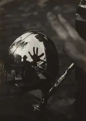 Imre Kinszki, Self-Portrait in Reflection of Car Headlight, circa 1934, Gelatin silver print