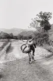 Bass player on the road Belgrade-Kraljevo, to play at a village festival near Rudnik, Serbia, Yugoslavia by Henri Cartier-Bresson, 1965, Gelatin silver print, printed later, sold Dec 2017