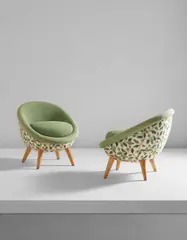 Jean Royere, Pair of low “Œuf” chairs, 1950s, Beech, sycamore, fabric