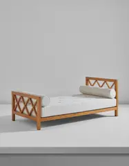 "Croisillon" daybed by Jean Royere, circa 1955, Oak-veneered wood, fabric, sold Jun 2017