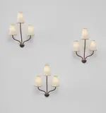 Set of three “Persane” three-armed wall lights by Jean Royere, circa 1953, Painted steel, traces of gold leaf, paper shades, sold Jun 2017
