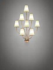 "Persane" eight-armed wall light by Jean Royere, 1950s, Gilded metal, cellulose shades, sold Jun 2017