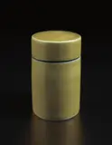 Lidded jar by Lucie Rie, circa 1960, Stoneware, yellow glaze, the interior of the lip and the underside matte blue with diagonal sgraffito lines, sold Jun 2017