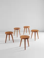 Set of five tripod stools by Charlotte Perriand, circa 1947, Ash, pine, offered Dec 2017
