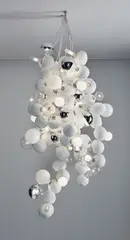 GuytonWalker, Untitled, 2009, 68 cast coconuts, electrical wiring and light bulbs