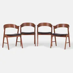 Set of four model '32' chairs by Kai Kristiansen, each teak frame with a curved back, sold Apr 2026