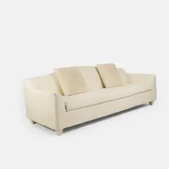 Three-seater sofa by Christian Liaigre, upholstered in ecru calico, sold Apr 2026