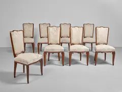 André Arbus, Dining Suite, rosewood, mahogany, brass, upholstery, comprising extending dining table and eight side chairs