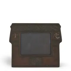 "AMERICAN INDIAN" CALENDAR FRAME by Tiffany Studios, New York, New York, early 20th century, brown patinated bronze, impressed stamp mark "Tiffany Studios New York 1187," ht, sold May 2025