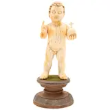 ORIGEN ORIENTAL, CA. by Niño Dios Salvador del Mundo, 1900, Talla en marfil con detalles entintados, con peana de madera enchapada con lámina de plata repujada y cubierta de textil, sold Nov 2025