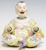 NODDER, SEATED PAGODA FIGURE by Meissen, sold Nov 2025