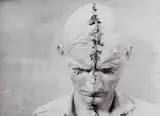 Günter Brus, Self-Painting I, Head Painting', Vienna, Operngasse, December 1964, 1964, Gelatin silver print, printed in the 1970s on single-weight glossy paper, in very good condition. Photographer's stamp on the reverse. PHOTOGRAPHER Ludwig Hoffenreich (1902–1975)