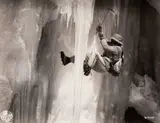 Ernst Baumann, Luis Trenker climbing an ice wall (film still), 1938, Vintage silver print on double-weight glossy paper