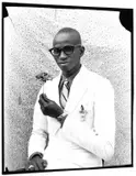 Seydou Keïta, Young man with a flower, 1958, Gelatin silver print, printed in the 1990s on double-weight semi-glossy paper c
