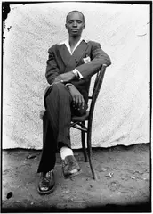 Young man in pinstripe suit, 1950s by Seydou Keïta, Gelatin silver print, printed in the 1990s on double-weight semi-glossy paper c, sold May 2026