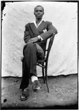 Seydou Keïta, Young man in pinstripe suit, 1950s, Gelatin silver print, printed in the 1990s on double-weight semi-glossy paper c