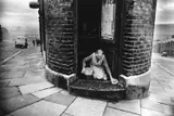 Collin Jones, Shopkeeper washing her doorstep, Benwell, Newcastle-upon-Tyne, England 1963, 1963, Gelatin silver print, printed later on double-weight semi-matte paper