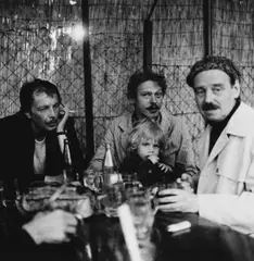 Franz West, Reinhard and Konrad Priessnitz, Otto Kobalek at a wine tavern, Vienna 1977 by Cora Pongracz, 1977, Vintage silver print on single-weight glossy Agfa paper, sold May 2026