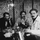 Cora Pongracz, Franz West, Reinhard and Konrad Priessnitz, Otto Kobalek at a wine tavern, Vienna 1977, 1977, Vintage silver print on single-weight glossy Agfa paper