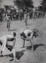 George Rodger, Korongo Nuba wrestlers, Kordofan, Sudan 1949, 1949, Gelatin silver print, printed in the 1960s on double-weight matte, structured paper, in very good condition. Photographer's Magnum copyright stamp, negative-stamp with handwritten entries in ink "38"