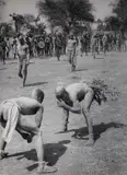 George Rodger, Korongo Nuba wrestlers, Kordofan, Sudan 1949, 1949, Gelatin silver print, printed in the 1960s on double-weight matte, structured paper, in very good condition. Photographer's Magnum copyright stamp, negative-stamp with handwritten entries in ink "38"