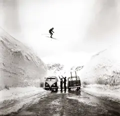 Hans Truöl, Skier jumping over the alpin road at Arlberg, Austria 1959, 1959, Gelatin silver print, printed in the late 1970s on single-weight glossy Agfa paper