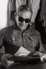 Eve Arnold, Clark Gable on the set of 'The Misfits', Reno, USA 1960, 1960, Vintage silver print on single-weight glossy paper, in very good condition. Photographer's Magnum stamp, negative no. stamp "60-20-106/13" and handwritten numerical annotations on the reverse. When th