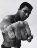 Thomas Hoepker, Muhammad Ali demonstrating his punch', Chicago 1966, 1966, Vintage silver print on double-weight semi-matte paper, in good condition. Signed by the photographer in pencil, handwritten negative number "2723-9" in pencil, two "Magnum Photos Inc." copyright labe