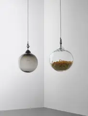 Alexandre Arrechea, Two works: i) Europe ii) At Dusk, 2007, i) hand-blown glass, sandblasted text, ashes, artist's metal fixture and metal chain ii) hand-blown glass, tape measure ribbons, artist's metal fixture and metal chain