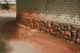 William Eggleston, Untitled (Side of brown stone wall, Arizona)