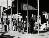 Sidewalk Scene, Selma, Alabama, December by Walker Evans, 1935, Gelatin silver print, print date unknown, offered Apr 2016