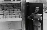 Louis Stettner, Elbowing Out of Town Newstand, NY