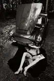 Jeanloup Sieff, Alone Under a Car with Open Hood, Paris