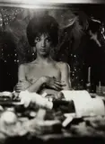 Diane Arbus, Seated female impersonator with arms crossed on her bare chest, N.Y.C.