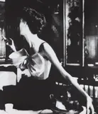 Lillian Bassman, Across the Restaurant, Barbara Mullen, dress by Jacques Fath, Le Grand Vefour, Paris, 1949, Gelatin silver print, printed later