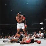 Neil Leifer, Muhammad Ali reacts after his first round knockout of Sonny Liston during the 1965 World Heavyweight Title fight at St. Dominic’s Arena, Lewiston, Maine, 1965, Chromogenic print, printed later